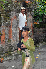Little girl steps out the temple