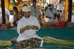 Making the garlands with bamboo leafs