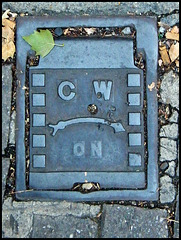 C W ON manhole cover