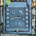 C W ON manhole cover