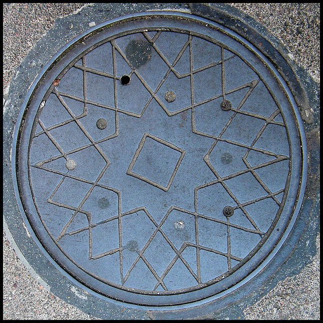 patterned coal hole cover