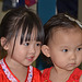 Two little girls in red