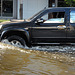 Pick up cars plague through the flood