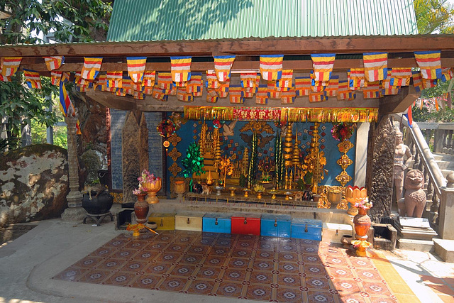 Holy altar on the steps to the reclining Buddha