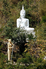 White Buddha statue at the mountainside