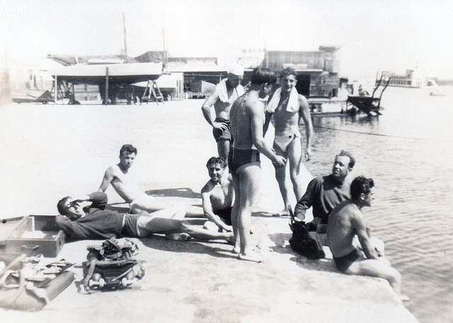 guys hanging around the harbour - doing what guys do. 1940'