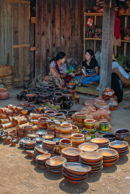 Intha market women offer their pottery products