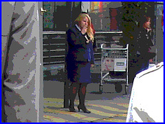 Distant blurry chubby blond flight attendant smoker in high heels  /  Hôtesse de l'air dodue en pause-cigarette - Brussels airport -19-10-2008 - Postérisation