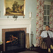 Pipe-Smoking Man in Front of the Fireplace