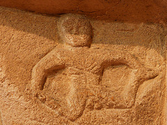 swell c.1130 exhibitionist figure, chancel capital