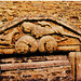 ampney st.mary glos. c.1120 A lion strides across two beasts' heads towards a griffin on this odd shaped c12  tympanum