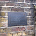 Hole in the wall plaque