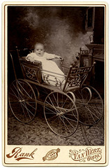 Startled Baby in Ornate Carriage