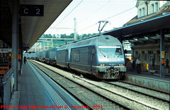 BLS #465018-0 Heading Freight Train through Spiez Bahnhof, Picture 1, Edited Version, Spiez, Frutigen-Niedersimmental, Switzerland, 2011