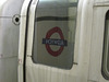 Station sign reflected in tube
