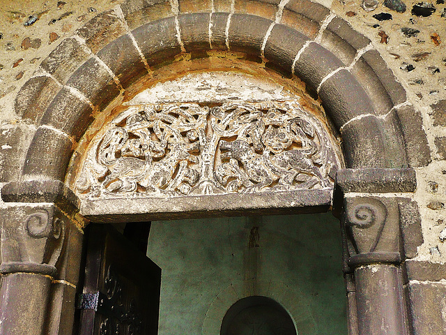 wordwell church,suffolk,early c12 doorway, with dog like lions either side of a tree on the tympanum probably carved mid c12