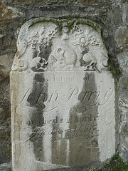 st.nicholas church, rochester,skulls and flowers on gravestone of john parry, fixed to the front of st.nicholas church in the cathedral precinct. it dates from the 1720s.