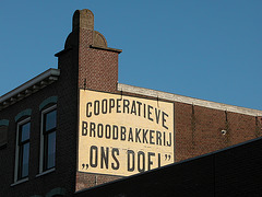 Repainted old advertisement for cooperative bakery "Our Goal"