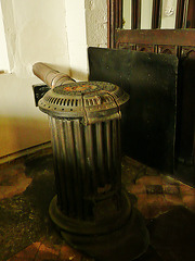 higham church, kent,tortoise stove of 1863. this one by the screen has a home made fire guard fixed up next to it