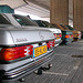 Rear ends of some Mercedes W123s