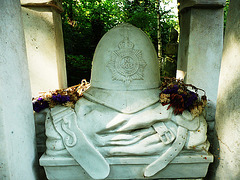 abney park cemetery, hackney, london,tomb of william frederick tyler, policeman, killed at tottenham whilst doing his duty, 1909, with his uniform folded under his helmet on his tomb