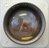 Me reflected in a Leitz projector lens