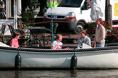 Students enjoying themselves in a boat