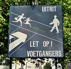 Sign warning against some 1950s pedestrians