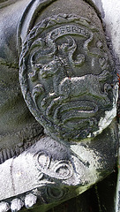 brompton cemetery, london,detail of one of the decapitated thames watermen, who wear doggett's coat and badge, from the tomb of champion oarsman robert coombes, 1808-60