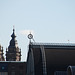 A trip with the steam tug Adelaar: Amsterdam Central Station and St. Nicolas Church