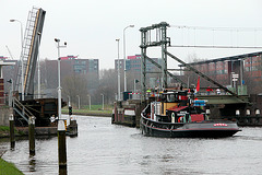 Ship passing the railway bridge near Leiden