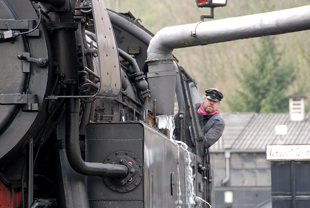 Engine 65 018 taking in water Engine 65 018 taking in water