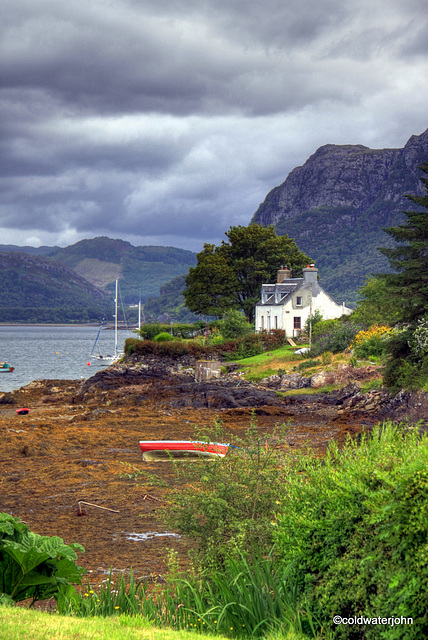 Low tide on small inlet at Plockton Village
