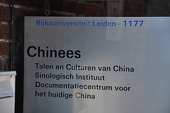 Old sign of Leiden University with "Rijksuniversiteit"