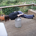 Emilie planking on milk can... almost