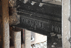 The names of famous steel factories on the buffer stops at Haarlem Station: Cockerill