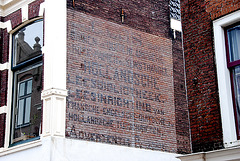 Faded wall ad for a private library