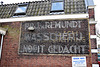Faded wall ad of the laundry "Nooit Gedacht" (Never Thought)