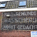 Faded wall ad of the laundry "Nooit Gedacht" (Never Thought)