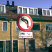 Old sign: no left turn (except for bicycles)