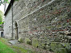 castle rising church, norf.north side of nave, with blocked c12 doorway and large stone footings