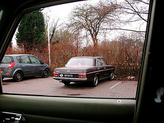 1972 Mercedes-Benz 200 seen through the open window of a 1980 Mercedes-Benz 200D