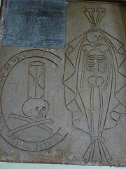 bromham church, wilts,incised skeleton, skull, hourglass on tomb on tower wall to ferdinando hughes, +1640 and two daughters +1647