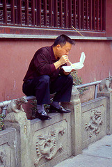 Modern Shanghai Man Eats his Dinner the Traditional Way