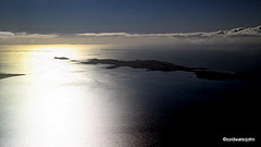 Aerial: Gigha Island and the west into setting sun