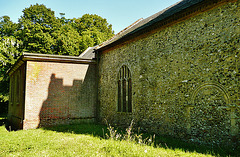 warham st.mary magdalen church,norf. , blocked c12 doorway, c15 window, and the c18 brick turner mausoleum on the north side of the church