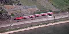 German train riding along the Rhine