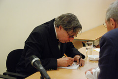 The writer J.M.A. Biesheuvel signing a Russian translation of his work