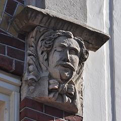 Ornamental head with a monocle