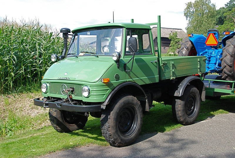 Unimog pulling a tractor